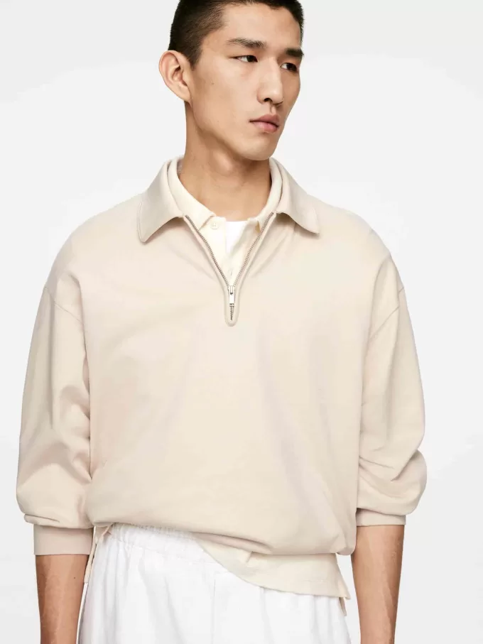 Poloshirt mit halbem Reißverschluss Poloshirt mit halbem Reißverschluss