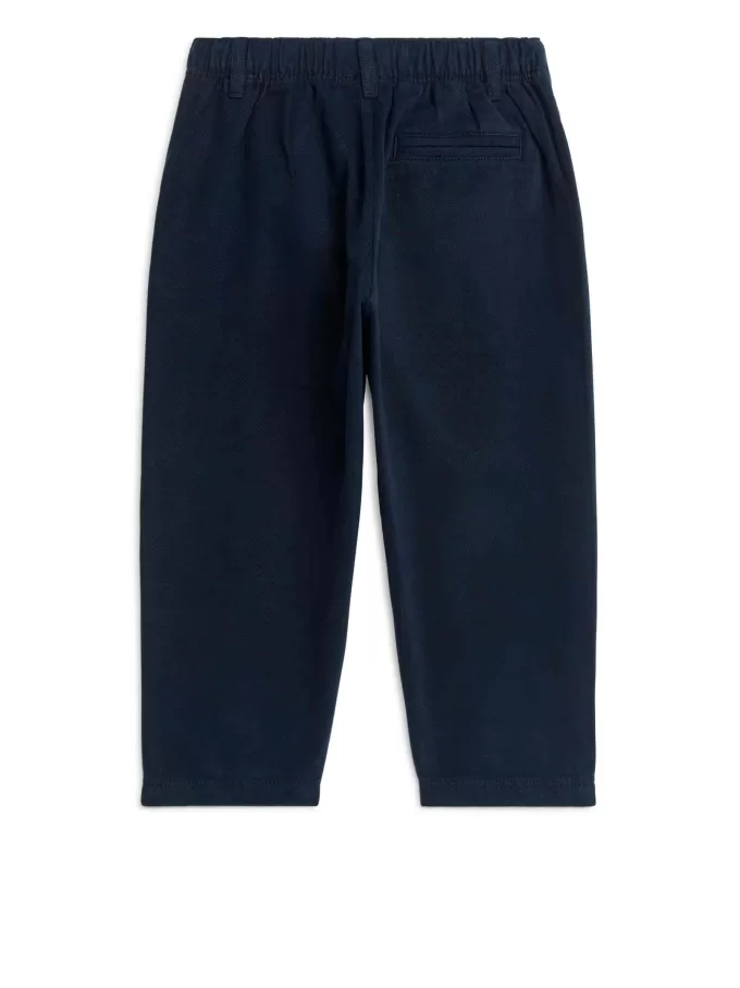 Schmal zulaufende Baumwoll-Chinos Schmal zulaufende Baumwoll-Chinos